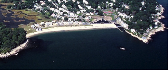 pocket beach aerial photo showing indented beach surrounded by rocky land